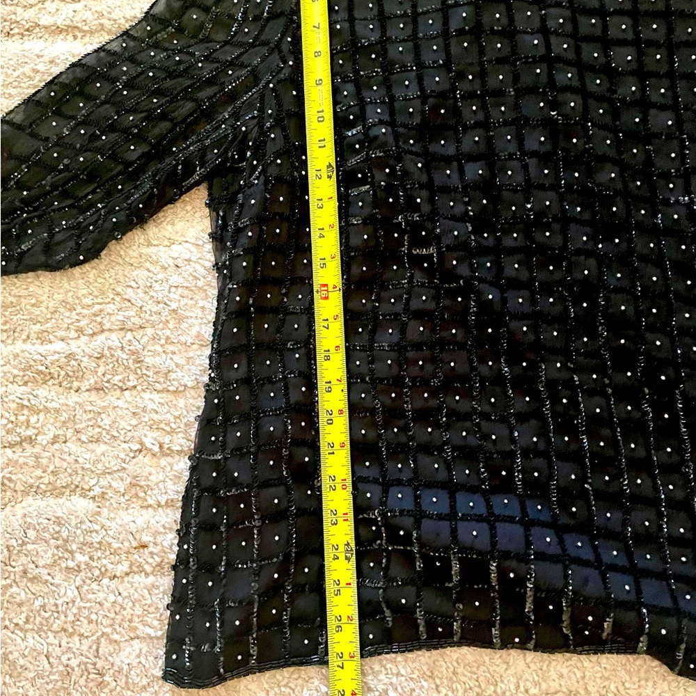 Beaded and sequined black top.